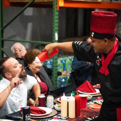 Chef serving a customer.