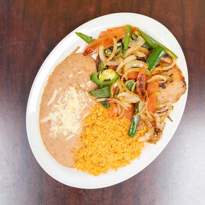 Various food in white dish served on the table.