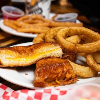 Grilled cheese sandwich and onion rings.