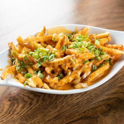 Cheese fries with scallions.