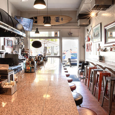 Restaurant interior, bar area, main entrance in the back