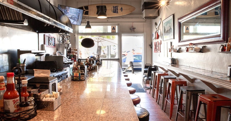 Restaurant interior, bar area, main entrance in the back