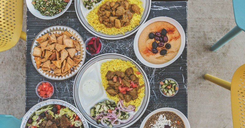 Assortment of Mediterranean dishes spread on the table, overhead view