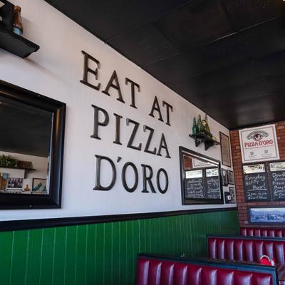 Dining area with 3D wall writing.