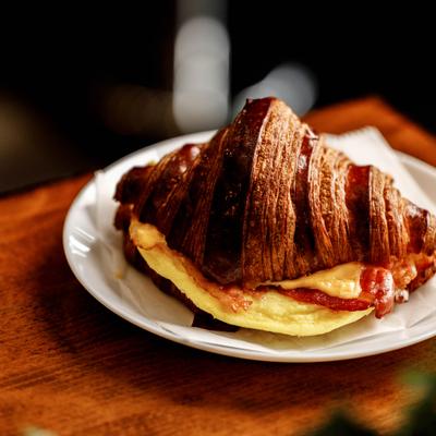 Egg, cheese, and bacon croissant sandwich.