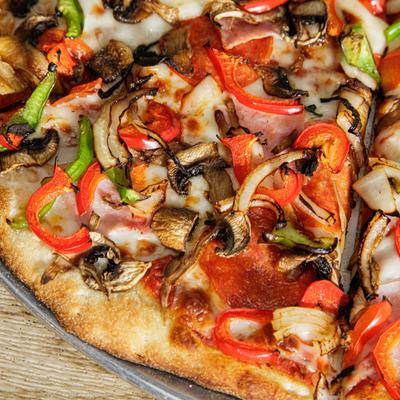 Supreme Pizza, with grilled onion, red and green peppers, cheese, and mushrooms.