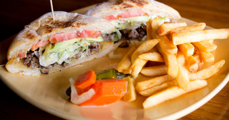 Beef sandwich served with fries