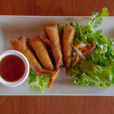 Rocket shrimp rolls with lettuce, herbs, pickled vegetables, and sweet chili dipping sauce.