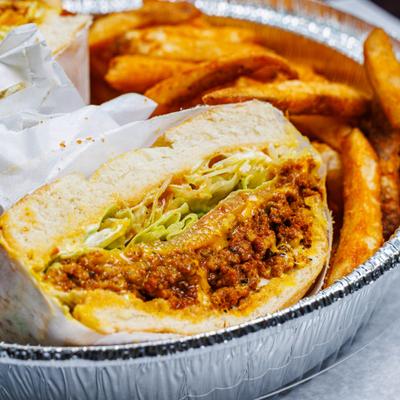 Chop Cheese sandwich served with fries.