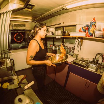Kitchen employee preparing food