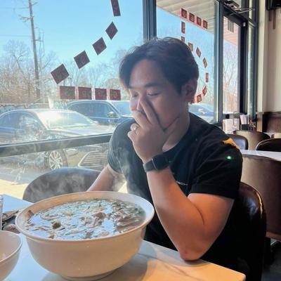 Guest preparing to eat a large bowl of soup.