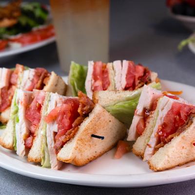 Turkey club sandwich with bacon, lettuce and tomato.