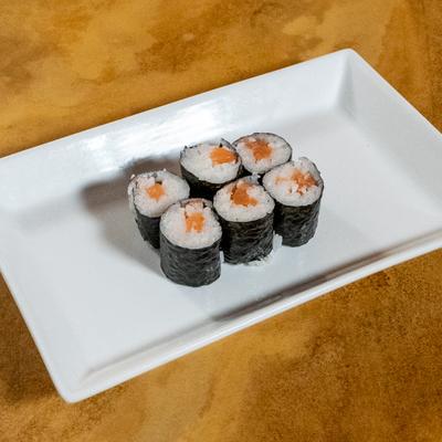 Salmon sushi rolls in seaweed wrap.