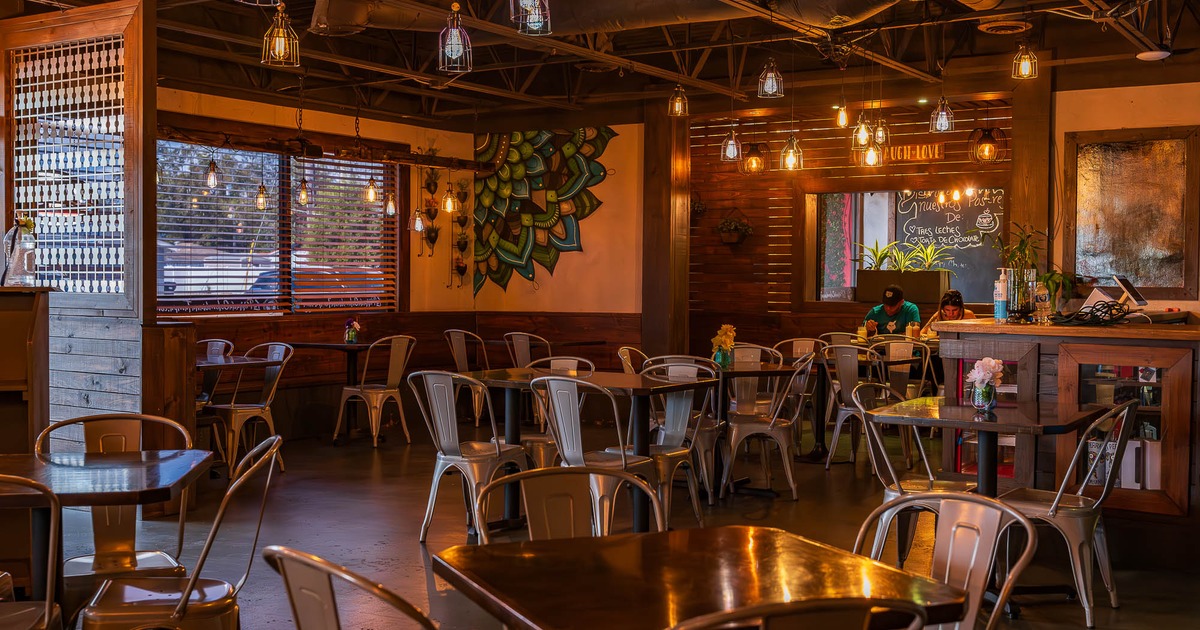 Main dining area with tables and chairs ready for guests