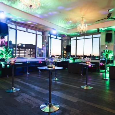 Seating area with green lighting.