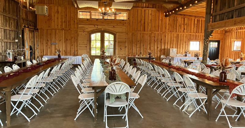 Interior, event space, long table setups for many guests, wooden top tables with chairs