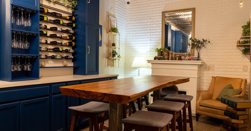 Cozy interior with vintage furniture, yellow sofa, artwork and plants