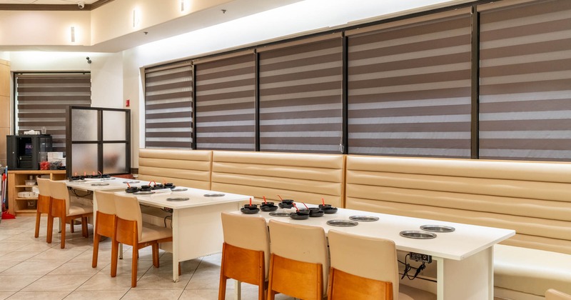 Interior, tables, chairs and high back leather benches