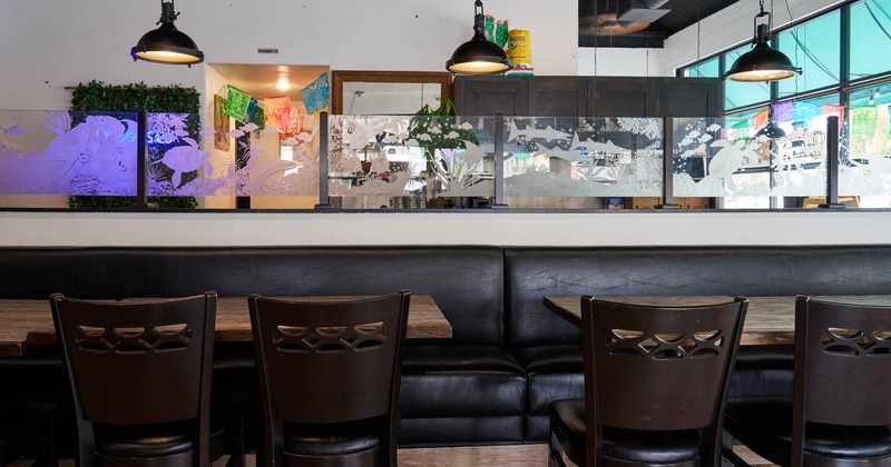 View of a dining space, tables ready for guests