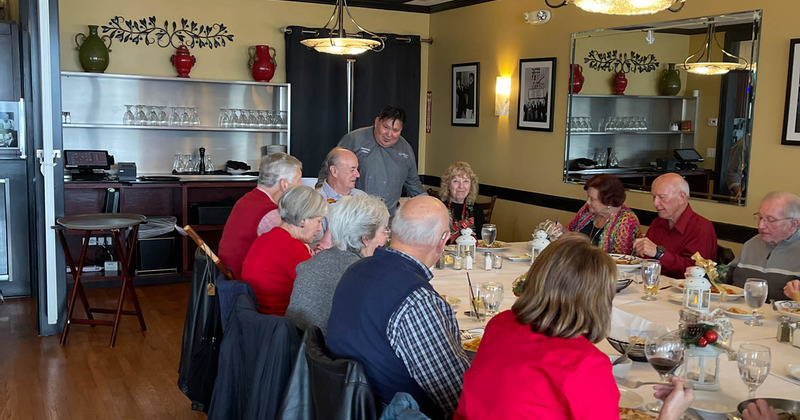 Interior, chef talking to guests