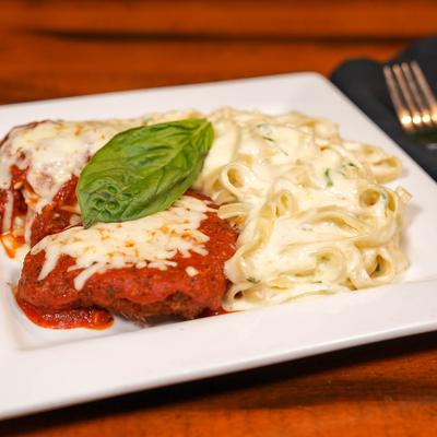 Chicken Parmesan with a side of pasta.