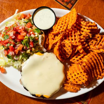 Southwest vegetarian black bean burger with melted mozzarella, fresh salsa, and waffle fries.