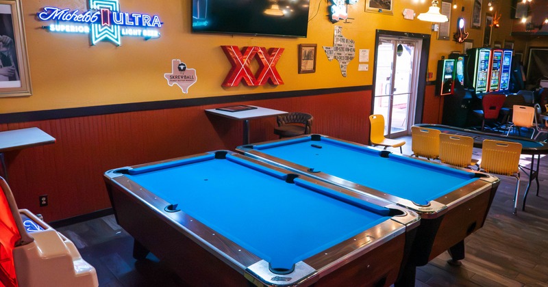 Interior, two blue pool tables