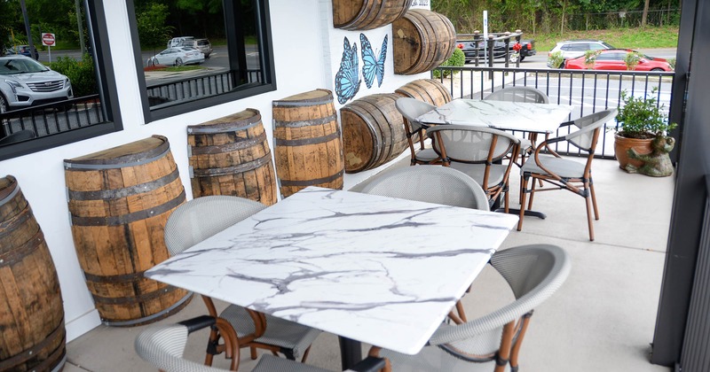 Patio, seating tables and chairs, decorative barrels