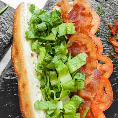 Sandwich with crispy bacon, tomato, and lettuce.