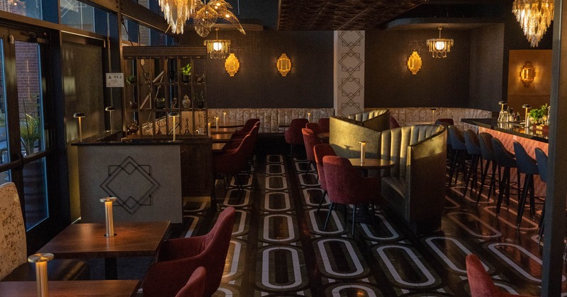 Interior, open space dining area, restaurant entrance, seating, stylish tile flooring