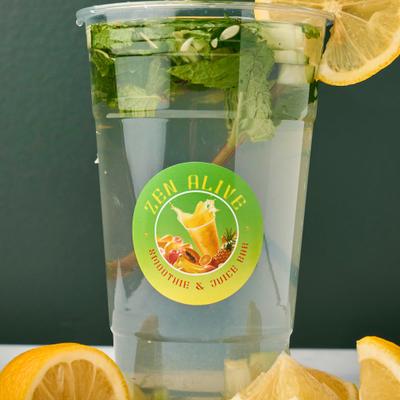 Cup of Lemon Water, garnished with mith and a slice of lemon.