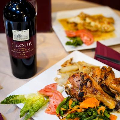 Chicken salad served with a bottle of wine