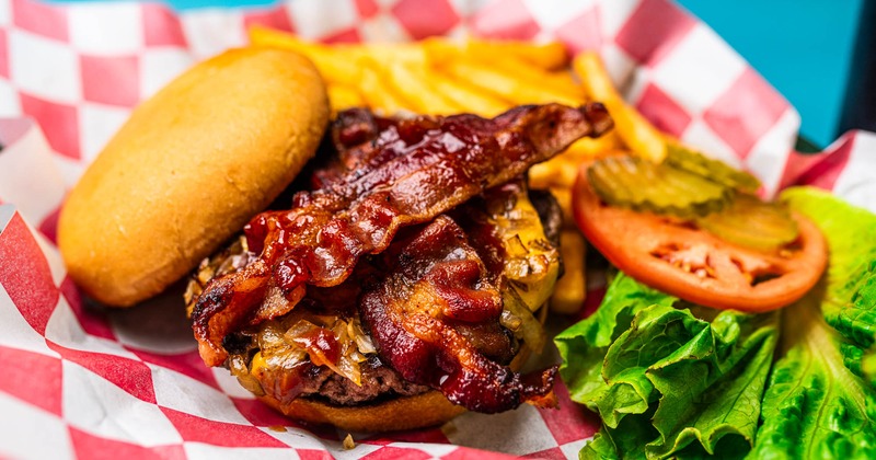 Bacon cheeseburger served with french fries
