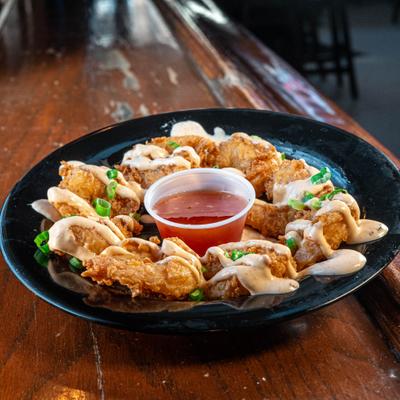 Fried shrimp with  firecracker sauce and scallions served with sweet chili dip.
