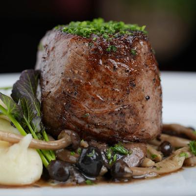 Filet mignon with whipped potato and wild mushrooms.
