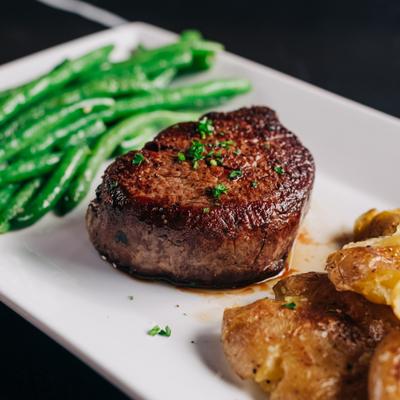 Filet mignon with green beans and smashed potatoes.