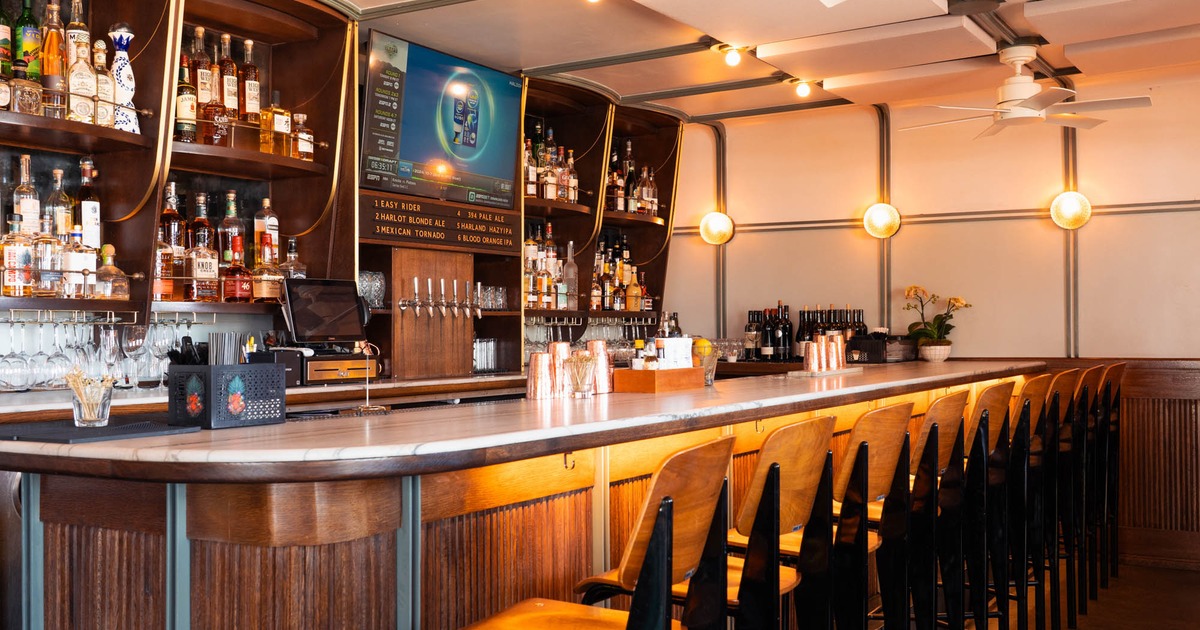 Well-sticked bar with stools and beer taps