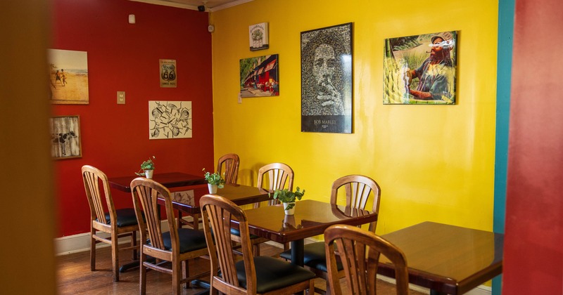 Interior, tables all lined up with pictures on the wall