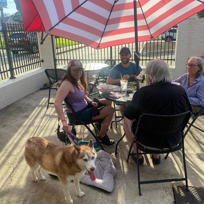 Guests sitting outside on the patio.