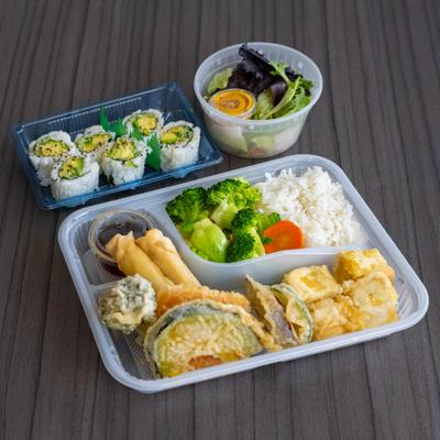 Yam maki rolls,  tofu tempura, spring roll, vegetable tempura, salad, and rice.