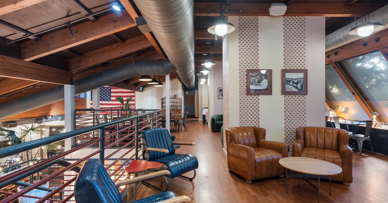 Interior, upstairs lounge and seating area, leather armchairs with coffee tables