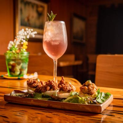 Hangtown Deviled Eggs plate, served with a cocktail drink