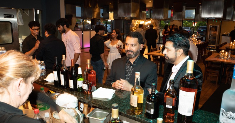 Bar area, Bar staff and guests at an event