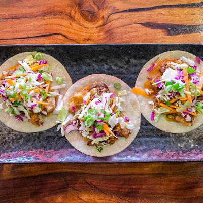 Braised pork belly tacos, with coleslaw.