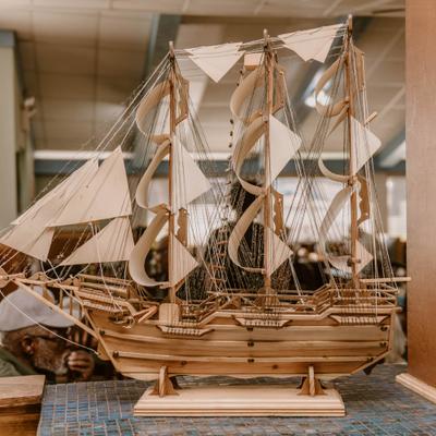 Decorative wooden model sailing ship.