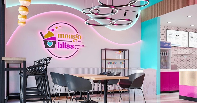 Modern dessert bar interior with colorful decor, neon logo and modern lighting.
