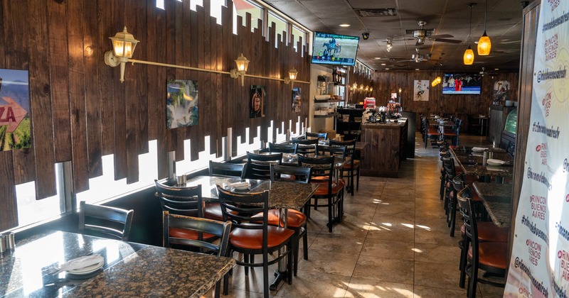 Interior, tables, chairs, wooden decorum, lights, ceiling fans, windows, LED TVs