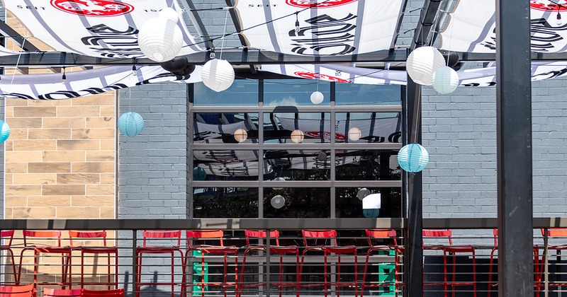 Exterior, seating area covered with awning