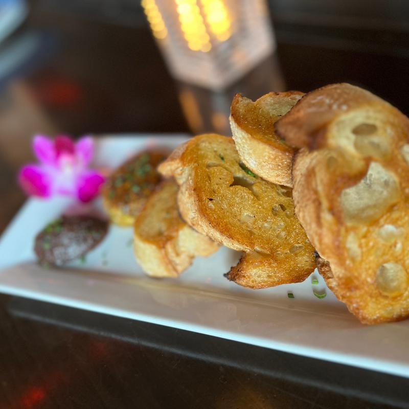 Baked goat cheese rolled in toasted pistachios, fig kalamata olive tapenade, macrina crostini - can be GF photo