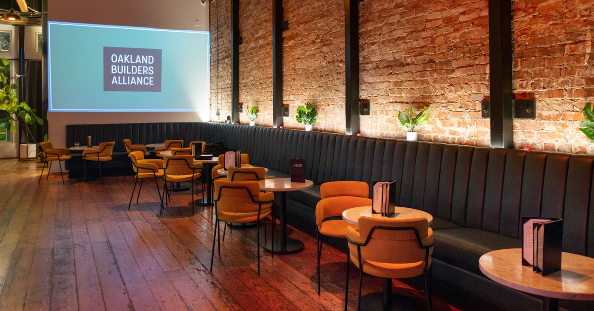 Interior, seating area with banquette seating, tables and chairs